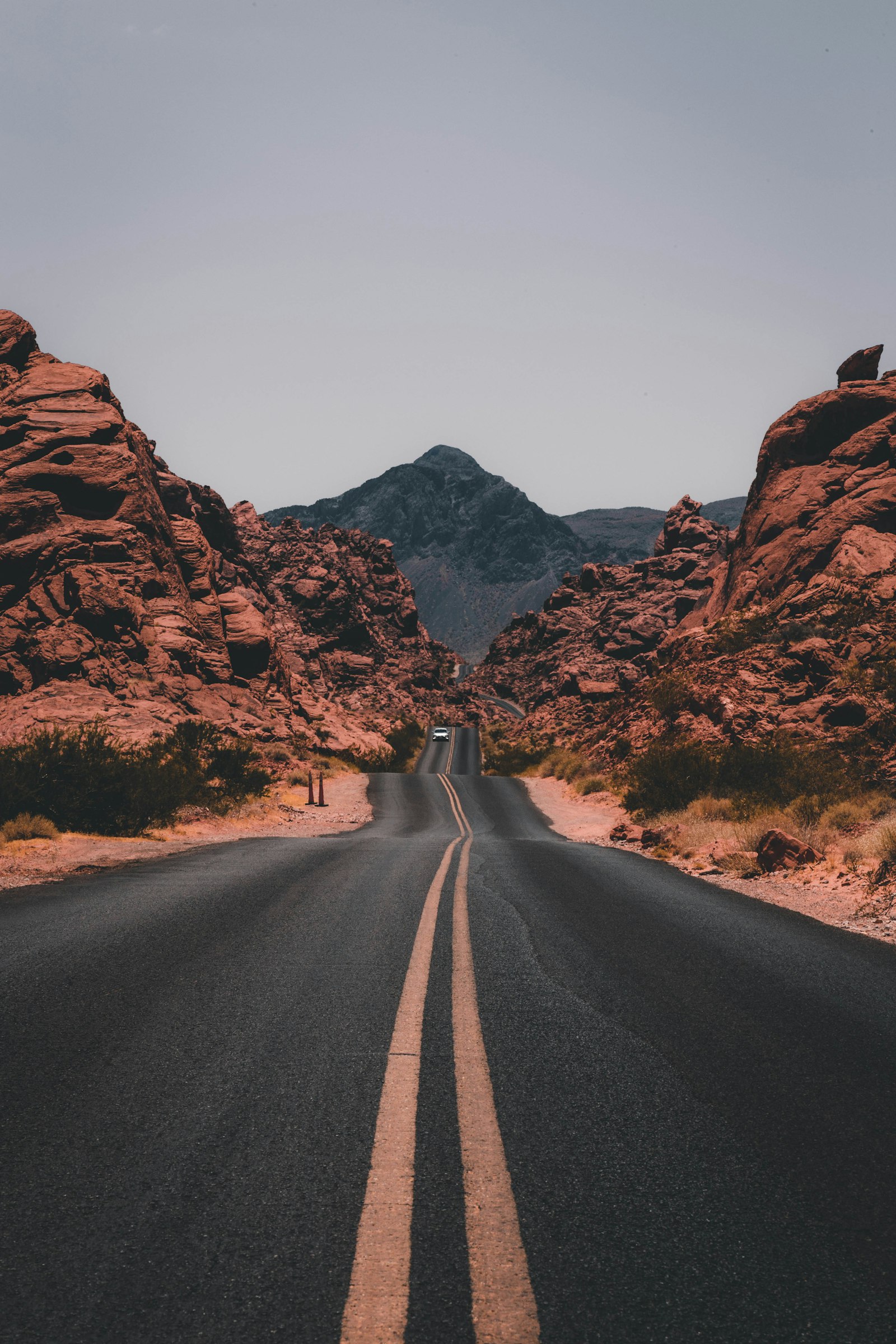 A road winding between red rock formations